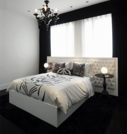 black walls bedroom with white bed