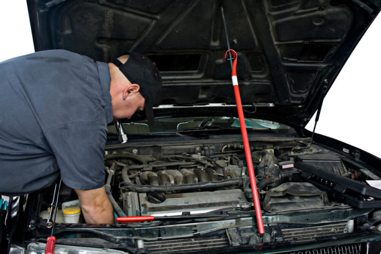auto electrician working in a car 768x512