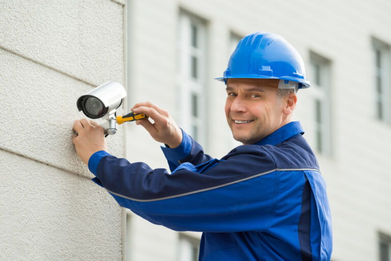 technician installing camera tinypng 768x513