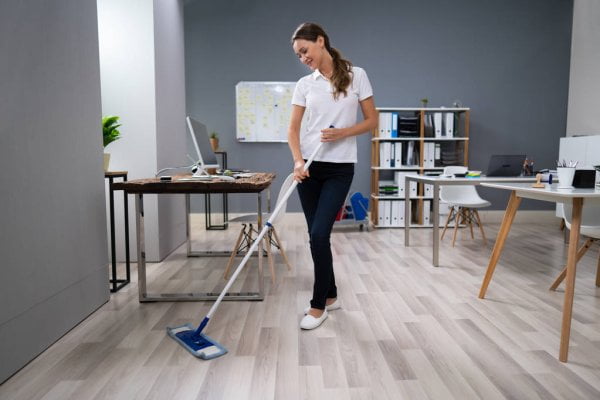 depositphotos 325534410 stock photo full length female janitor mopping