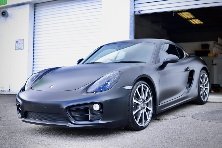 craftsmen automotive professionals paint protection services on porsche out side auto shop 768x512