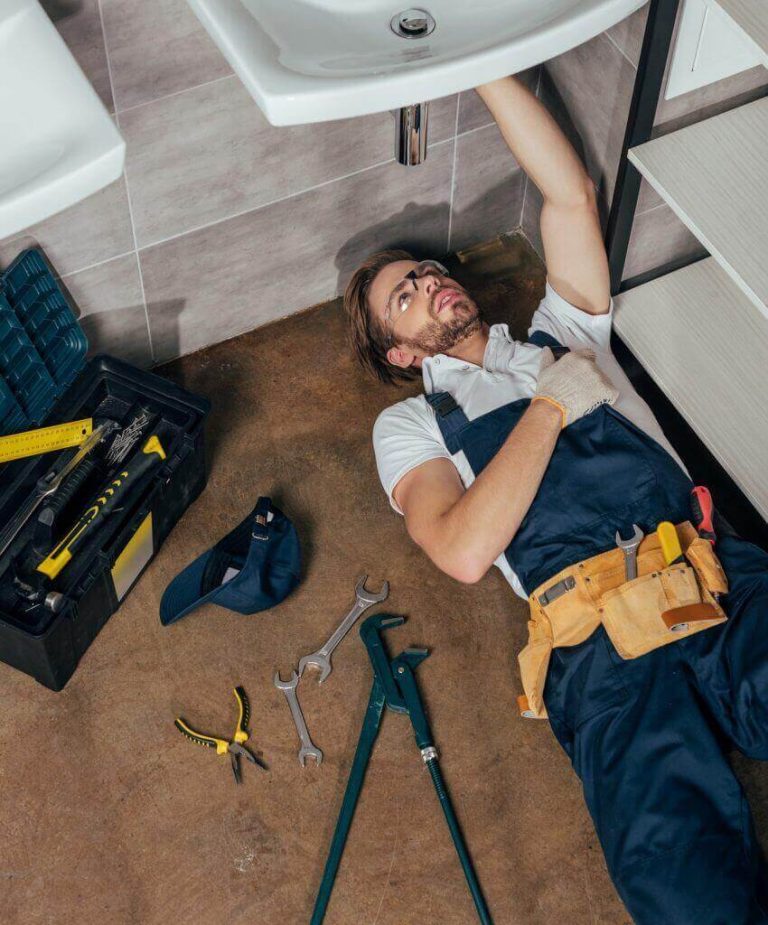 high angle view of young male plumber fixing sink in bathroom phwvi3huwjltx5yra5nthf3a2lxmhsyao53ypi43gg 768x925