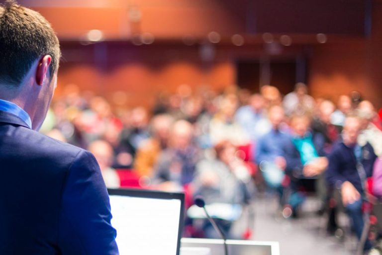 bigstock Speaker at Business Conference 68264065 1024x683 1 768x512