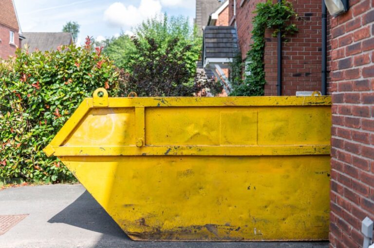 Big Yellow rubbish skip near the house. Rubbish removal hire during renovation of the house 768x511
