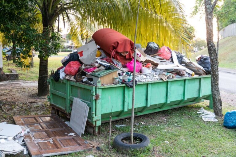 Removal rubbish dumpster bin with load of material for disposal from construction site 768x512
