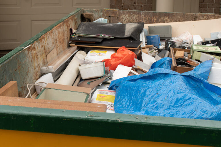 skip bin full of household waste rubbish on the fr 2022 11 15 14 04 17 utc 768x512